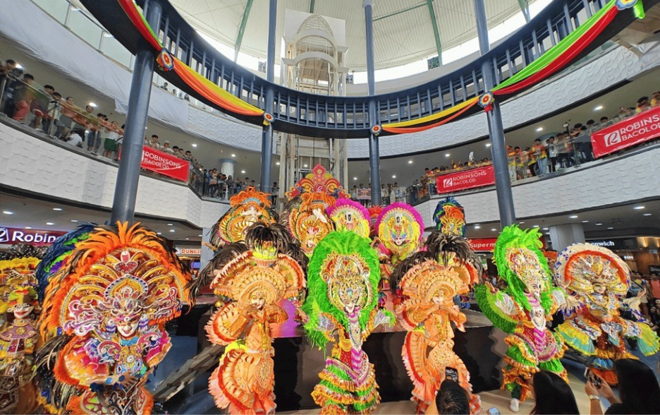 A group of people in colorful clothing

Description automatically generated